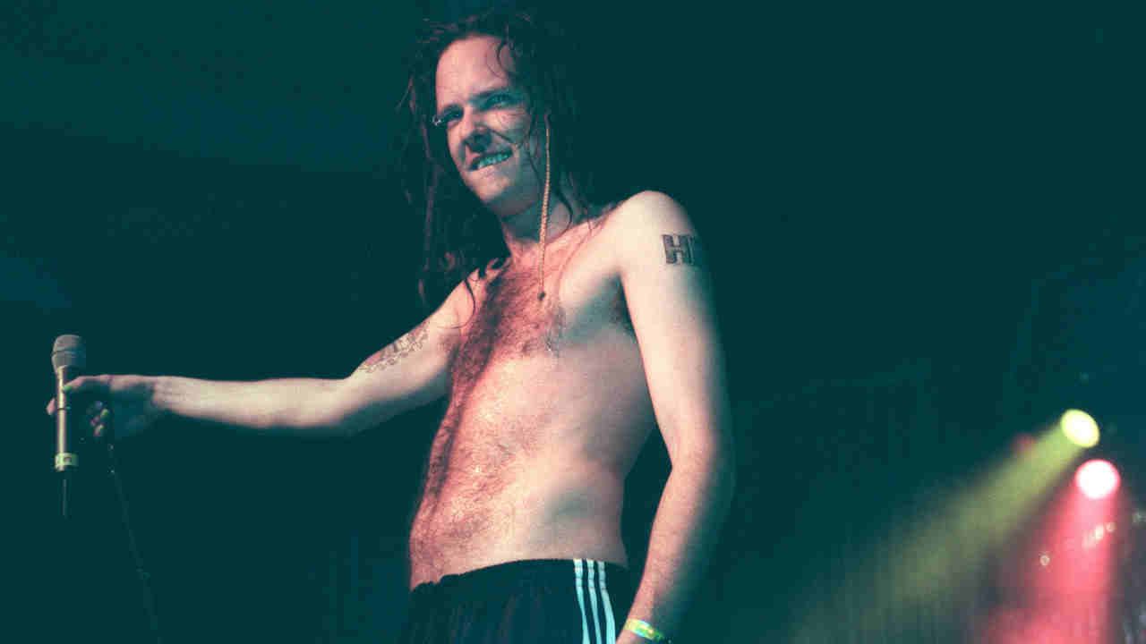 Korn’s Jonathan Davis performing onstage in 1996