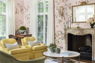 pink living room with yellow and green chairs