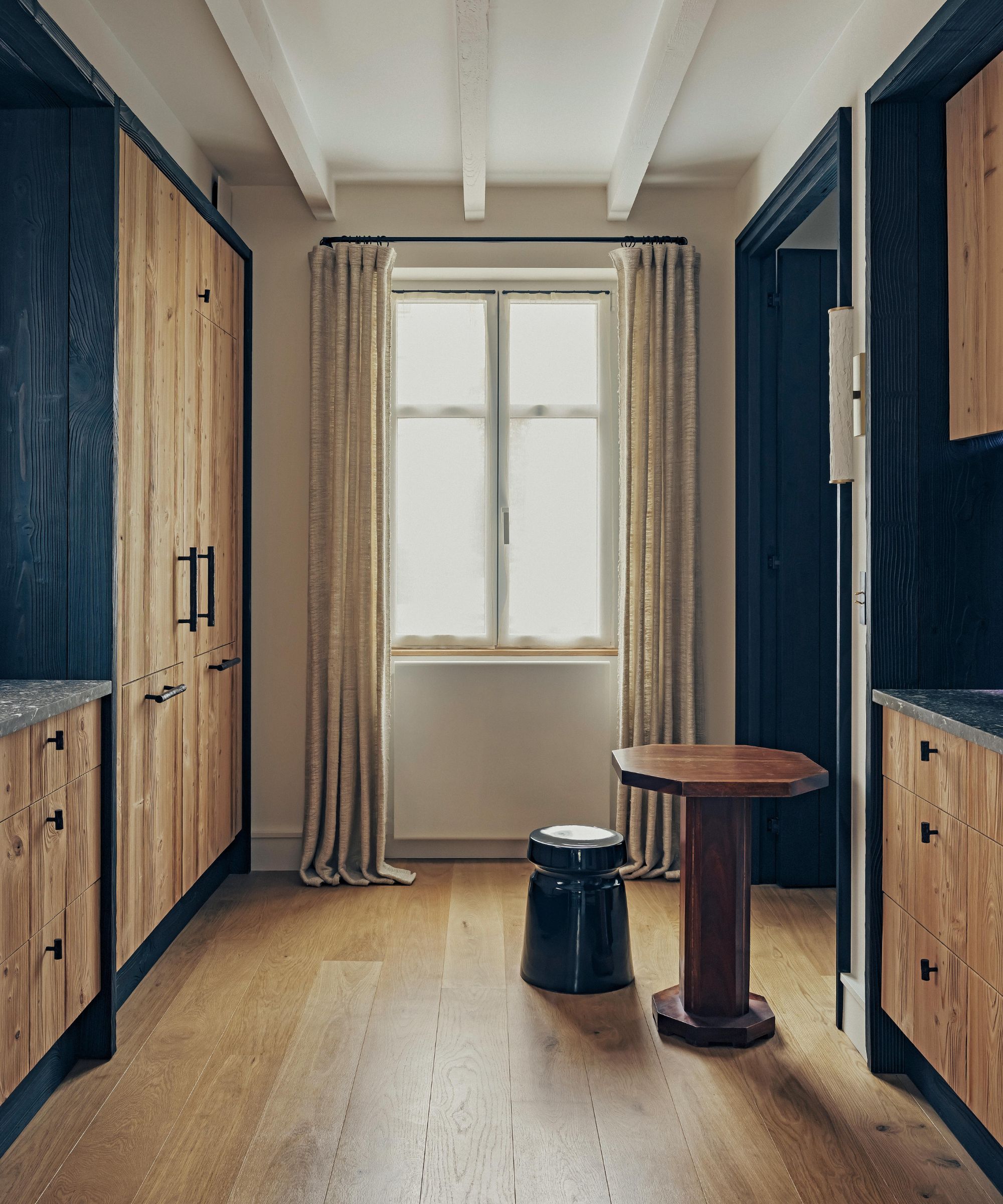a wood clad minimal meets rustic kitchen in a home in france