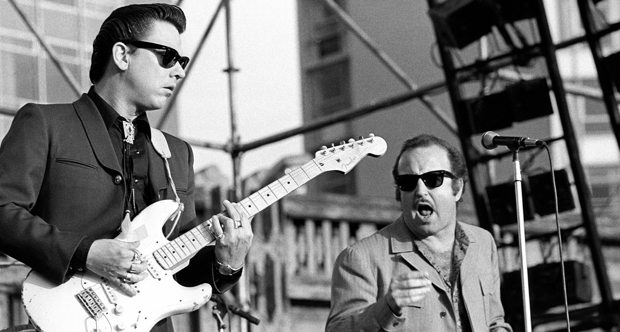 Jimmie Vaughan (left) and Ken Wilson perform onstage in 1985