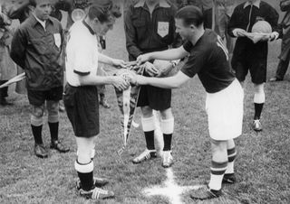 West Germany's Fritz Walter (left) and Hungary's Ferenc Puskas (right) exchanging the pennants ahead of the 1954 World Cup final.
