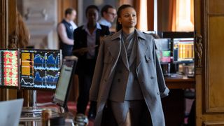 Harper walking through an office space in Industry season 4