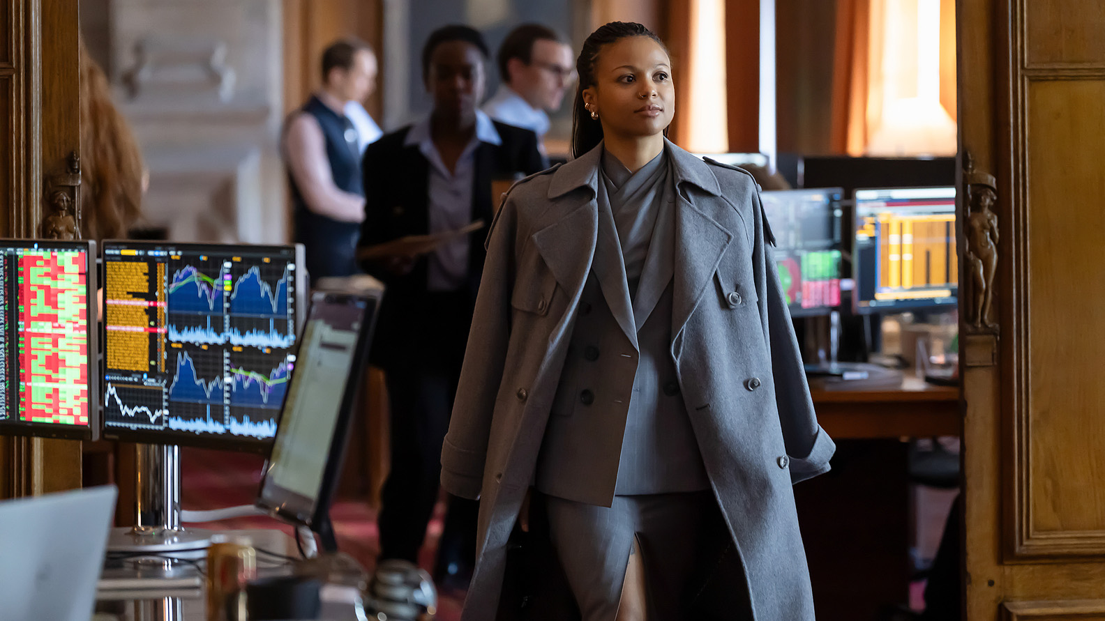 Harper walking through an office space in Industry season 4