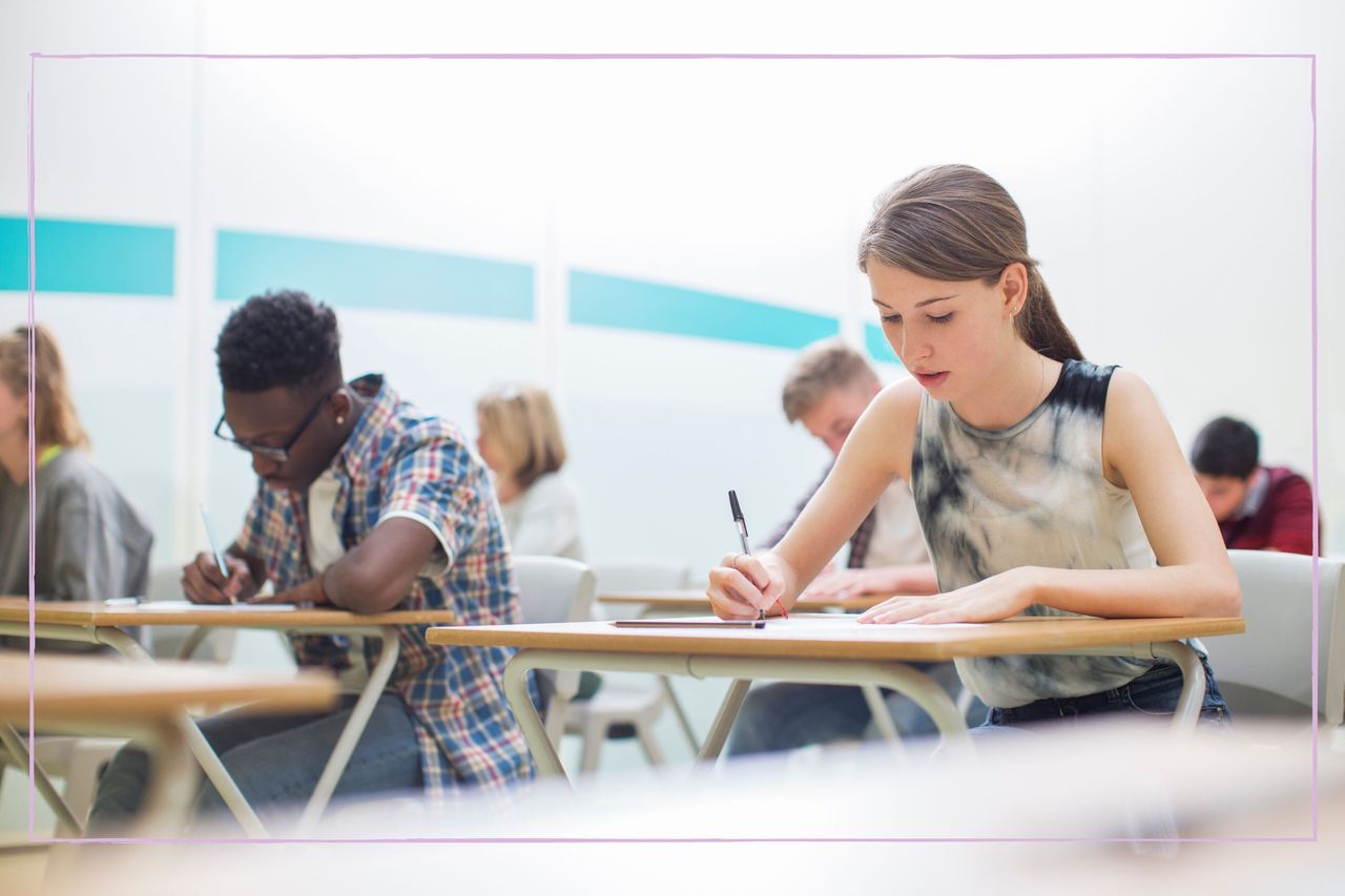 A group of students sat at desks while taking an exam