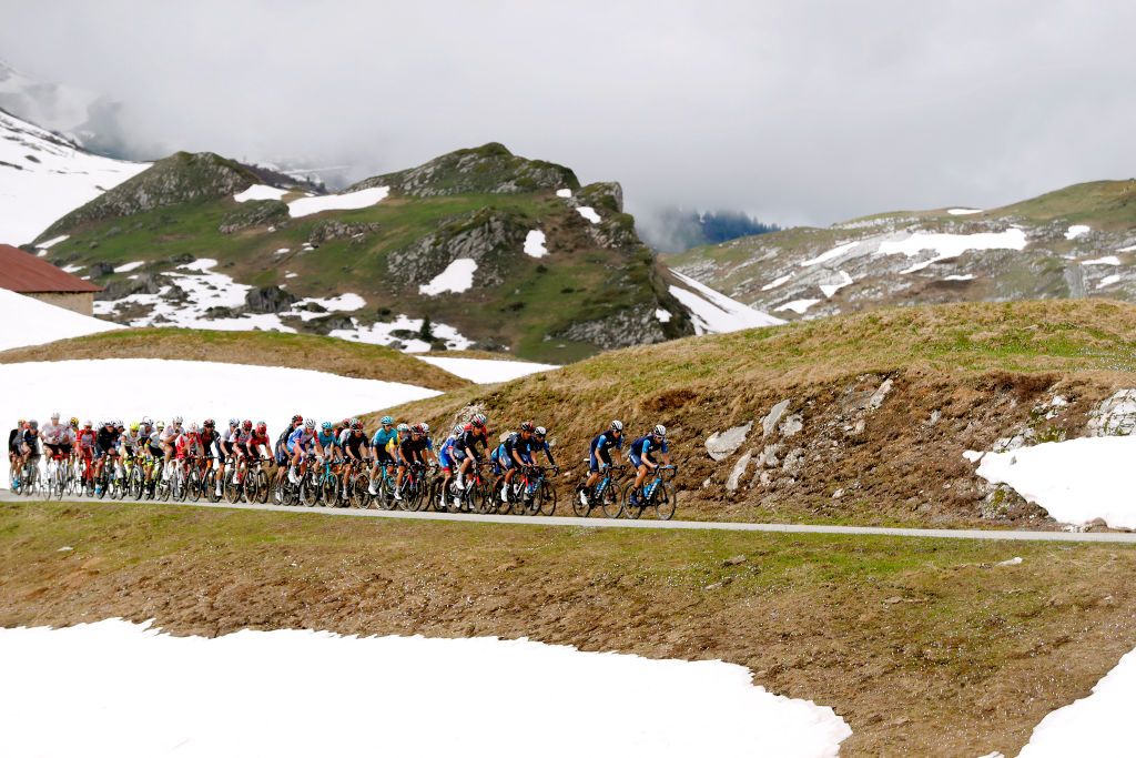 LA PLAGNE FRANCE JUNE 05 The peloton passing through Cormet de Roselend 1968m mountain landscape during the 73rd Critrium du Dauphin 2021 Stage 7 a 1715km stage from SaintMartinLeVinoux to La Plagne 2072m Snow UCIworldtour Dauphin dauphine on June 05 2021 in La Plagne France Photo by Bas CzerwinskiGetty Images