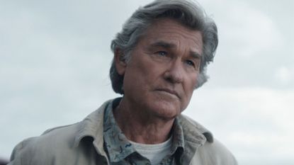 Kurt Russell looks mournfully into the distance