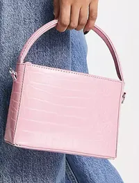 ASOS DESIGN boxy bag with top handle with detachable strap in pink croc, $27 (£19) | ASOS