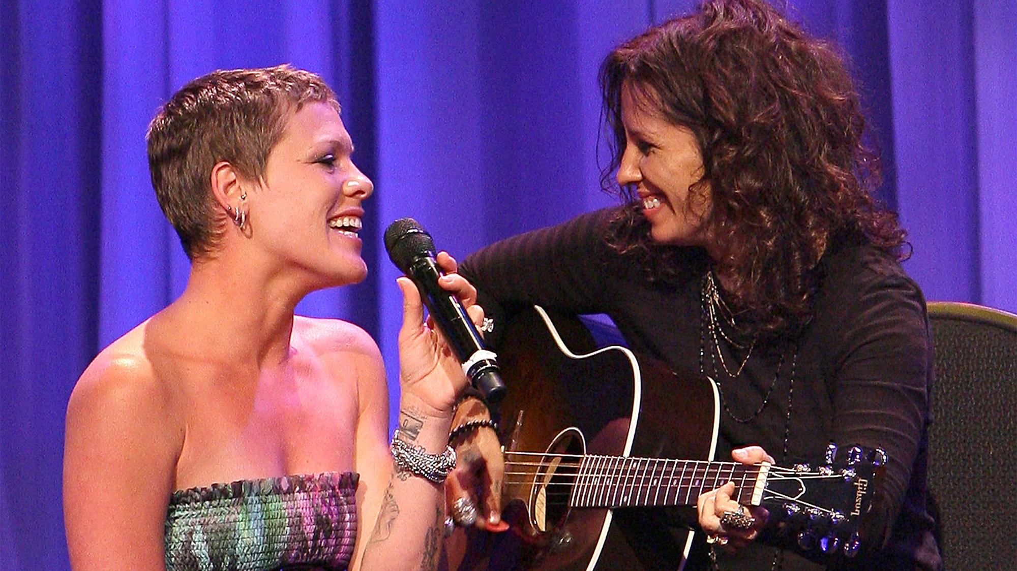 Singers Pink (L) and Linda Perry (R) perform at the L.A. Gay &amp;amp; Lesbian Center's &amp;quot;An Evening With Women&amp;quot; on May 1, 2010 in Beverly Hills, California.