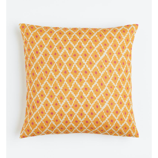 orange pink and cream pillow cover with a geometric pattern