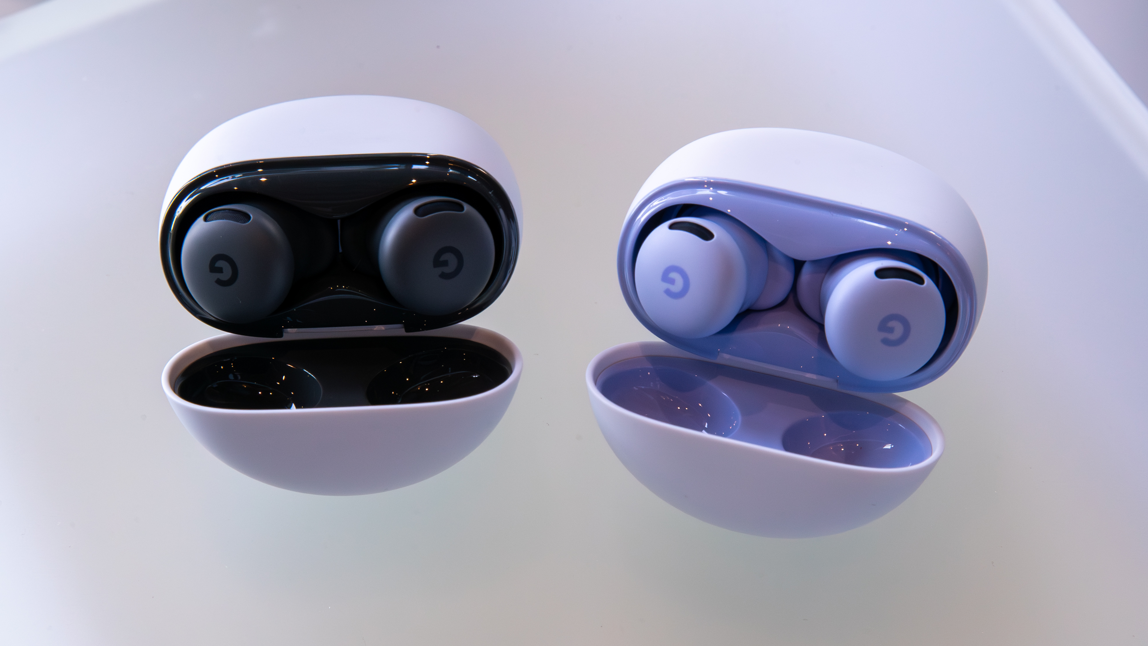 Pixel Buds 2a cases and earbuds in Hazel and Iris