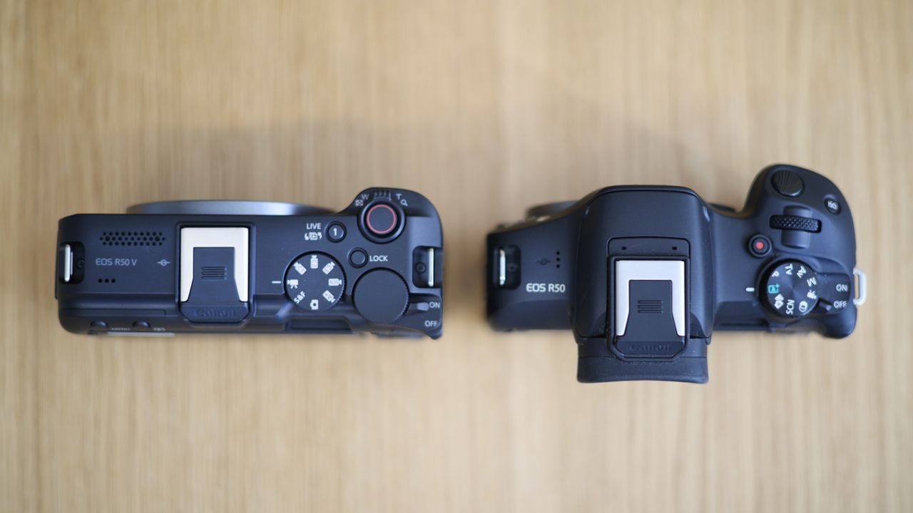 Canon EOS R50 V side by side with a Canon EOS R50 on a wooden surface