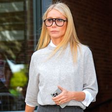 Gwyneth Paltrow arrived at Milan Fashion Week in capris, loafers, and a blue Goyard bag