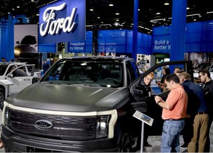 Ford EV trucks on display at an Auto Show