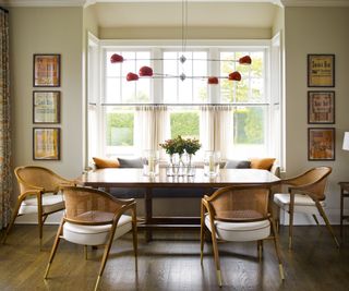 Dining room with large window and vintage decor