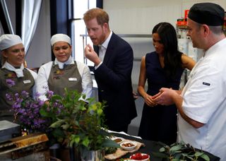 Prince Harry and Meghan Markle eating