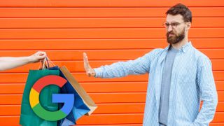 A man holding out his hand in a 'no thanks' gesture to an arm offering a handful of bags bearing the Google logo.