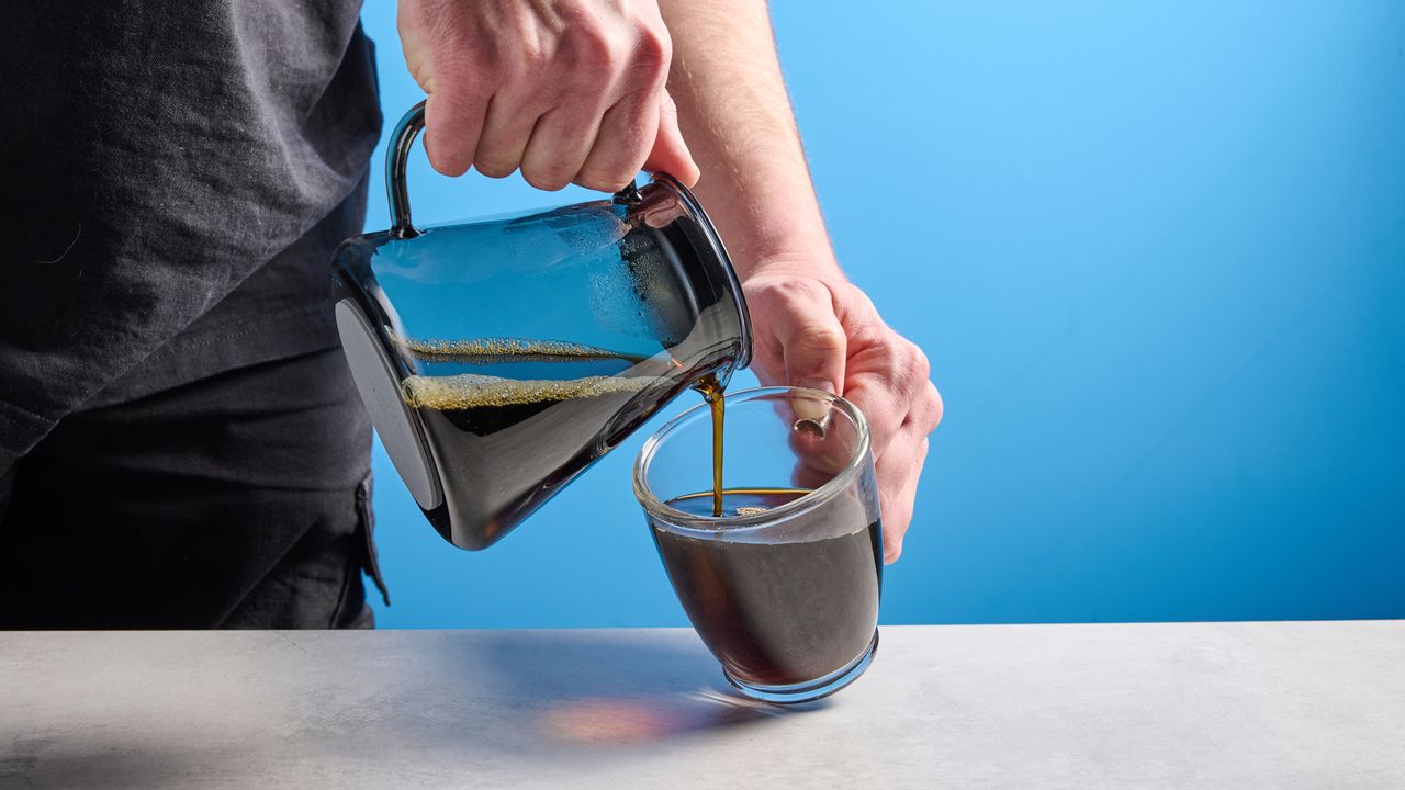 the ratio four coffee maker photographed against a blue tom's guide background