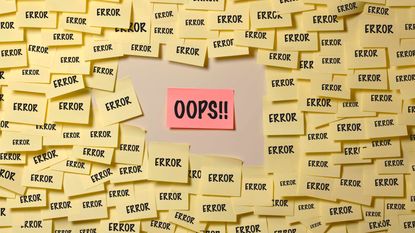 A Post-It Note reads "OOPS!!" It is surrounded by other Post-It Notes that read ERROR.