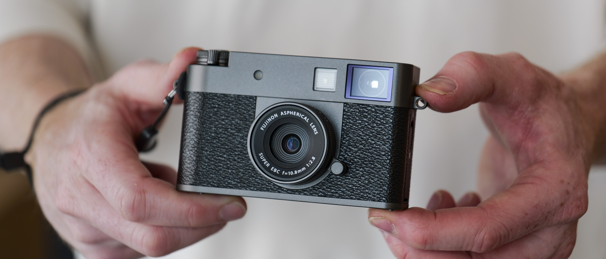 Fujifilm X half camera in the hand