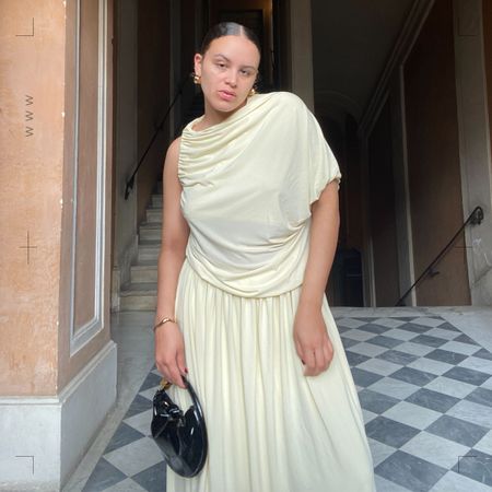 Woman stands in doorway.