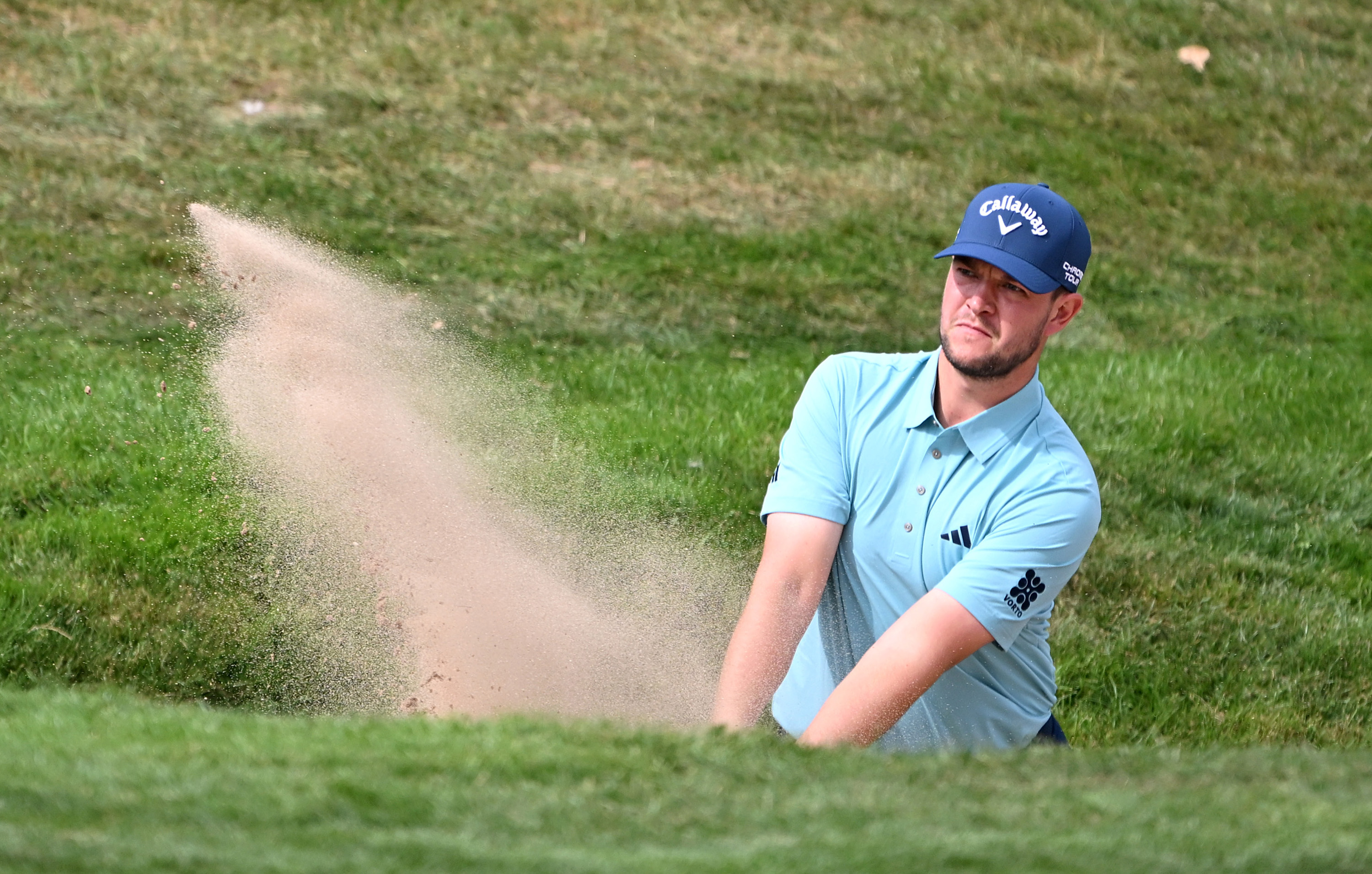 Sam Bairstow hits a bunker shot