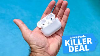 Apple AirPods Pro 2 USB-C in hand against a blue background with deal tag 