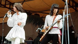 Mick Jagger and Keith Richards performing on stage, Jagger is wearing his Mr Fish dress.