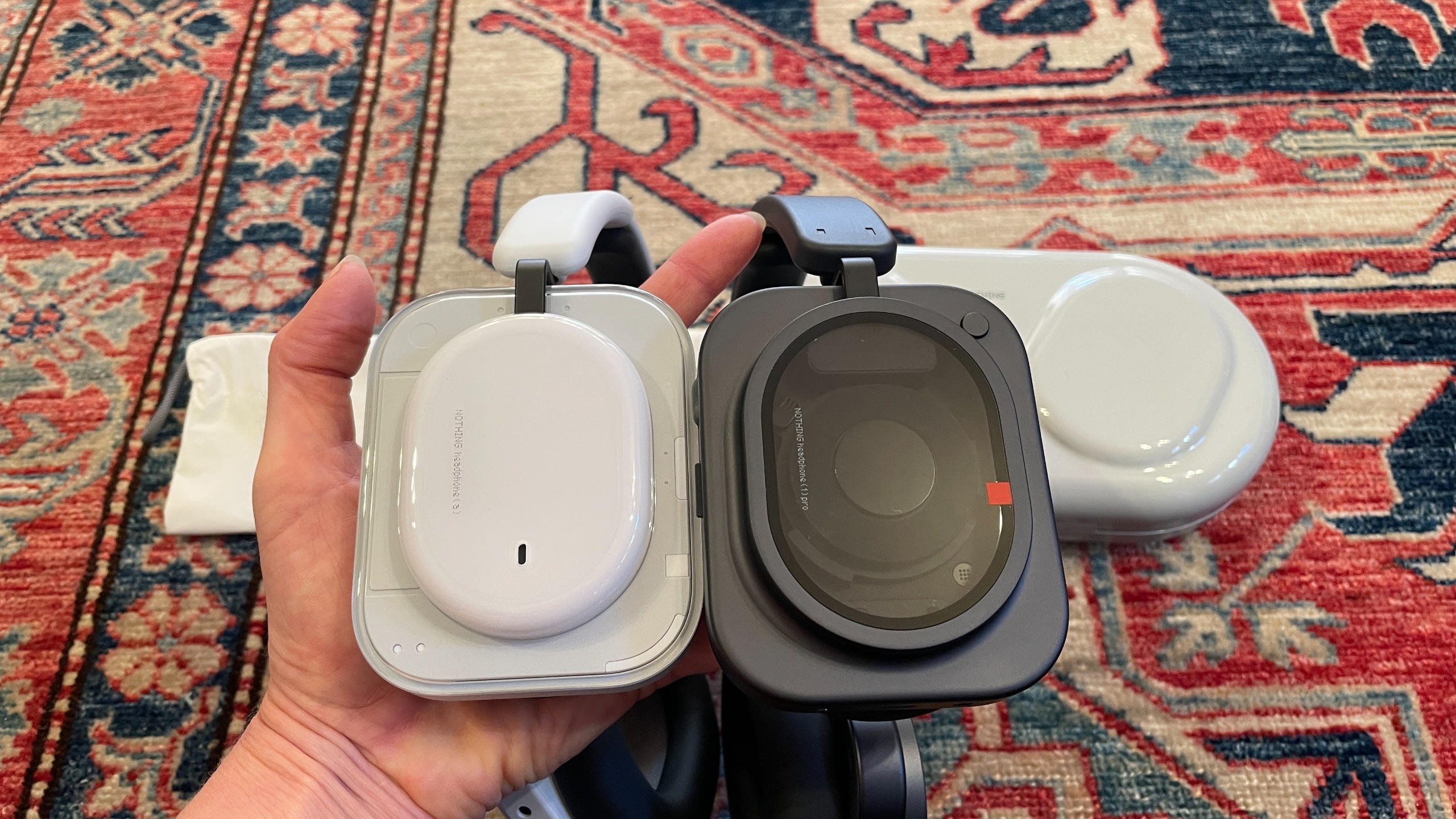 Nothing headphones arranged together, to show the different cases