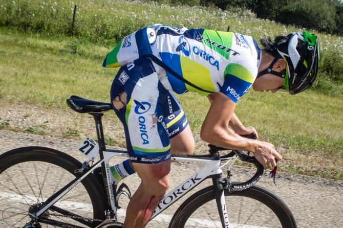 Kang Jiyong (Orica GreenEDGE) gets back up after a fall after taking a feed.