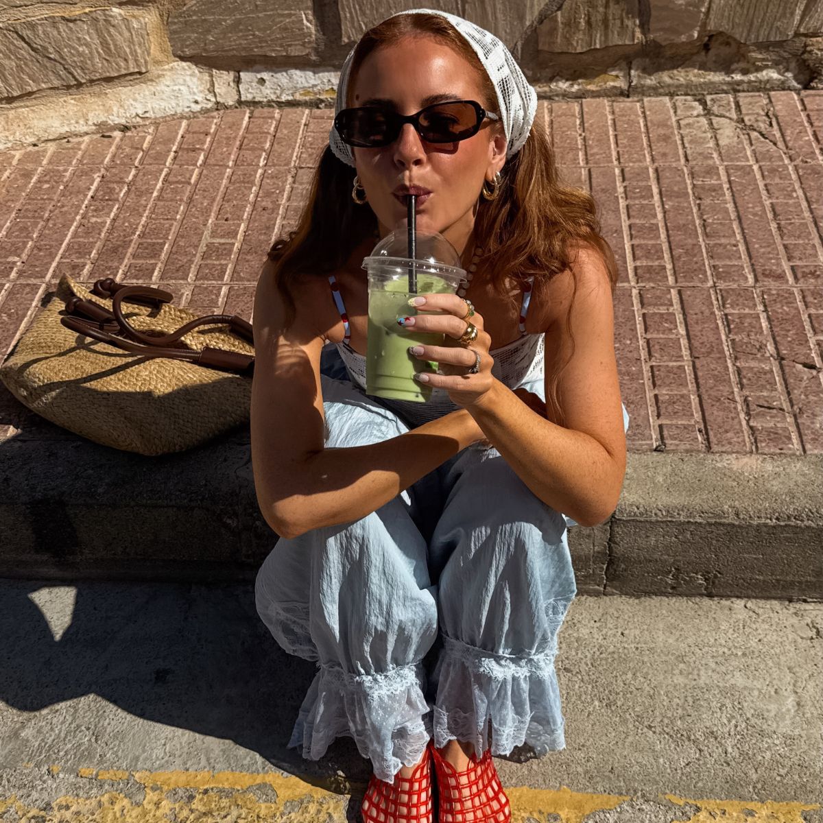 Rebecca Ferazwyatt sips matcha and poses for photo.