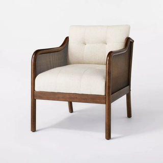 caned wood accent chair with white cushion