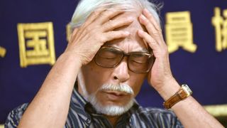 Japanese animation director Hayao Miyazaki holds his head in his hands