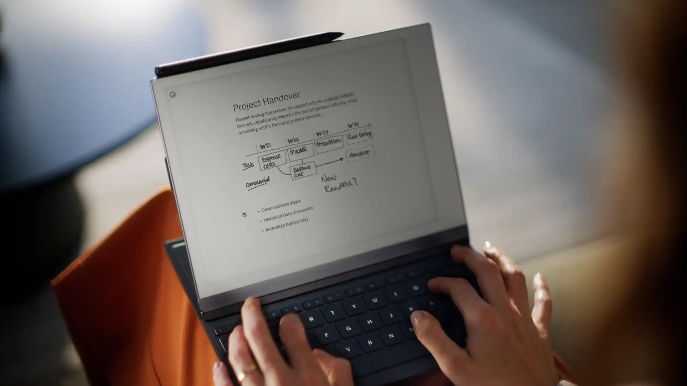 Hands typing on the new ReMarkable 2 tablet keyboard