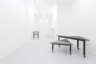 Inside Fashion to Furniture exhibition with architectural furniture in white room