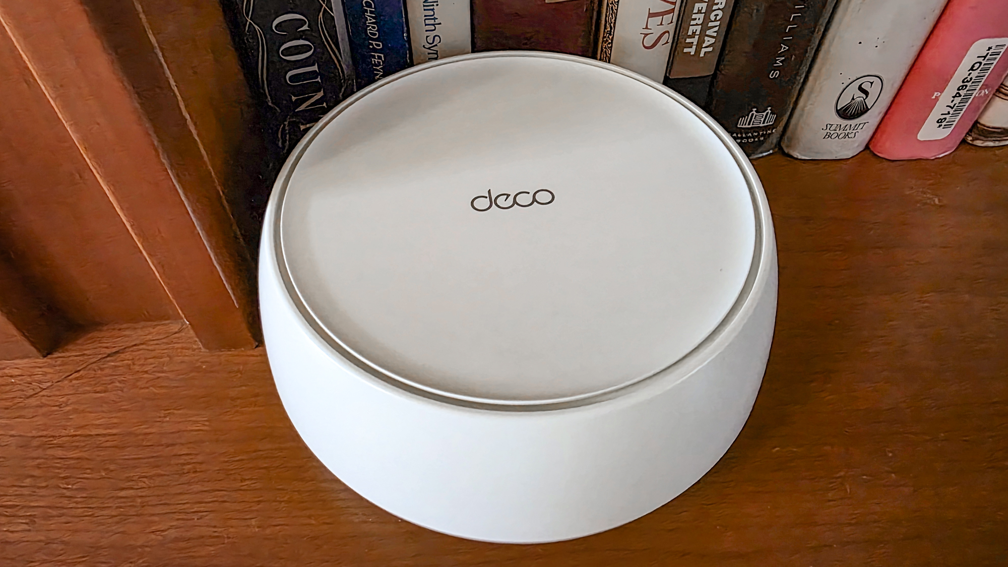 TP-Link Deco BE23 mesh router on a shelf