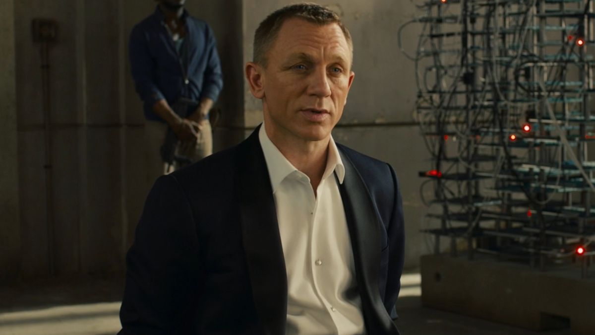 Daniel Craig sits with a curious expression while tied up in Skyfall.