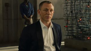 Daniel Craig sits with a curious expression while tied up in Skyfall.