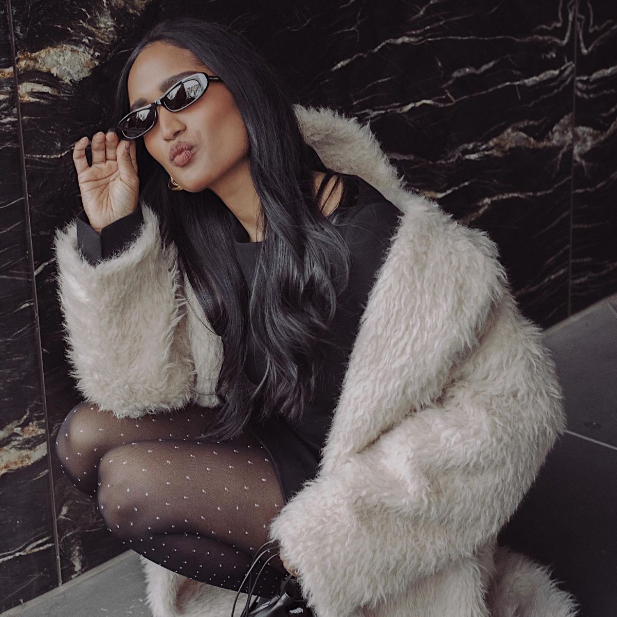 An image of @divrav polka-dot tights.