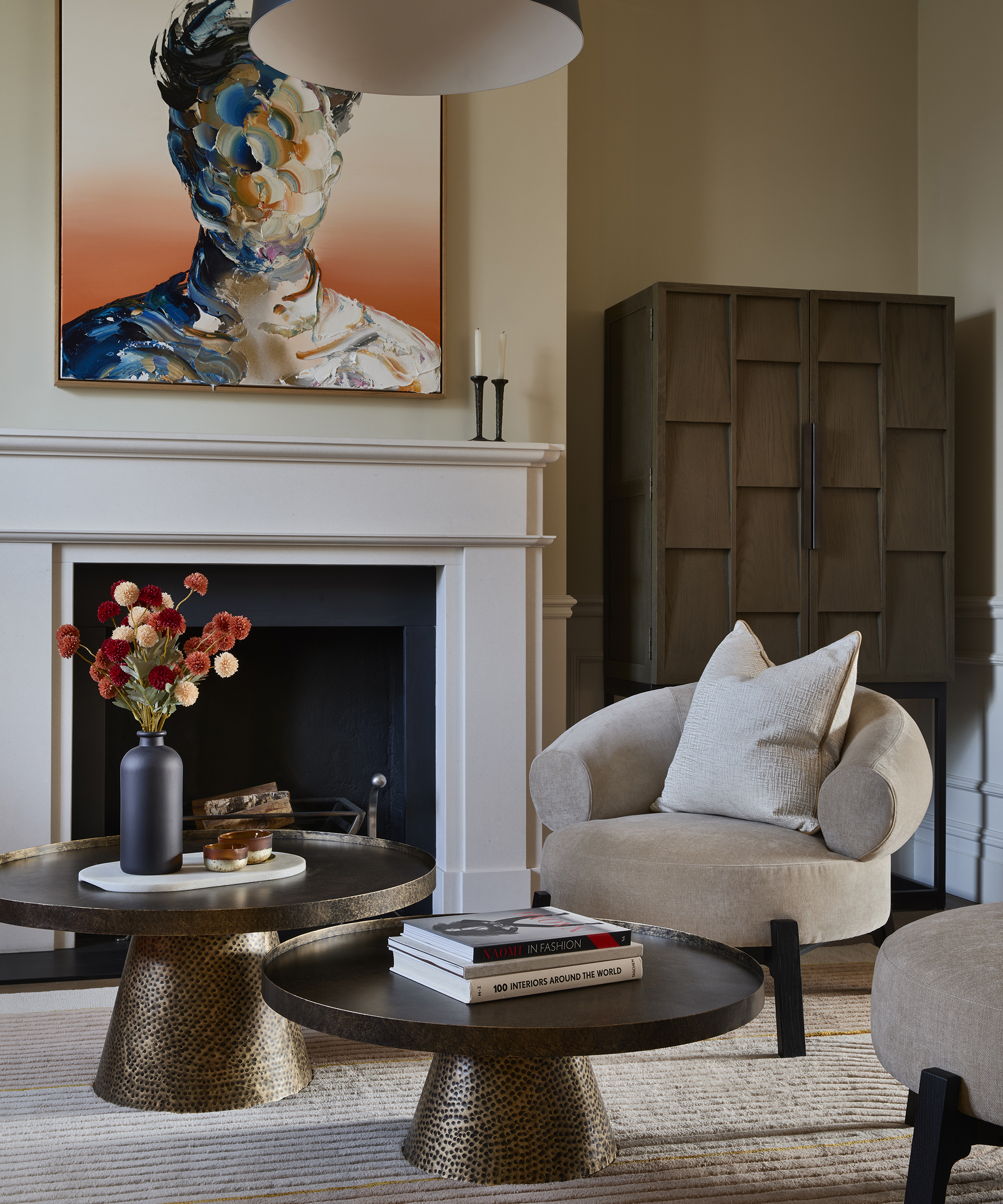 living room with two coffee table and colorful art