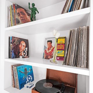 White walls with music collection and record player
