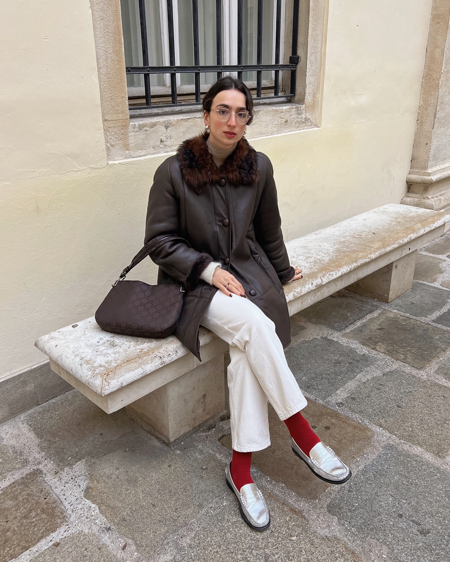 French woman wearing interesting socks with loafers.