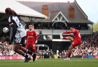 Trent Alexander-Arnold scores a free-kick for Liverpool against Fulham at Craven Cottage in April 2024.