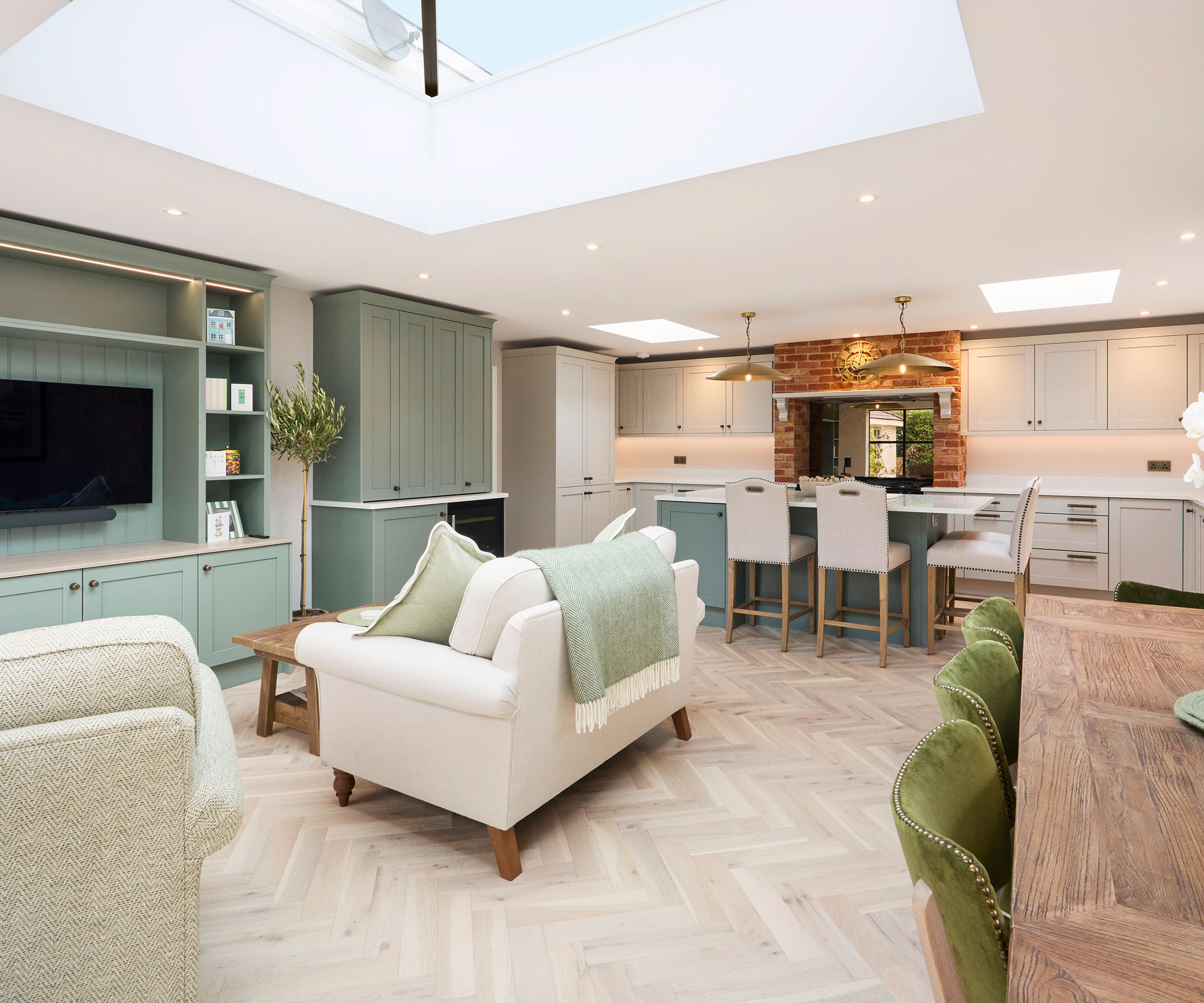 Open plan kitchen dining and living room with herringbone flooring
