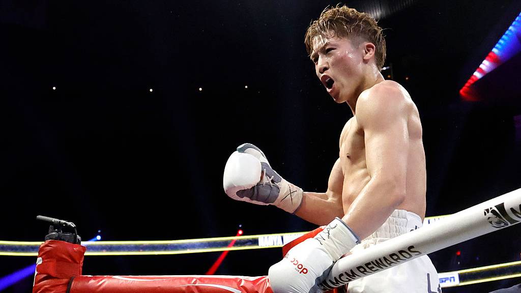 Naoya Inoue celebrates retaining his undisputed super bantamweight world title against Ramon Cardenas