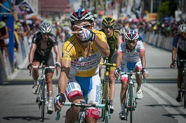 Tour winner Jose Serpa (Androni Giocattoli) indicates thats twice he has won the tour now after winning here in 2009.