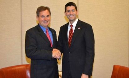 Indiana state Senate candidate Richard Mourdock shakes hands with Republican Vice Presidential nominee Paul Ryan. 