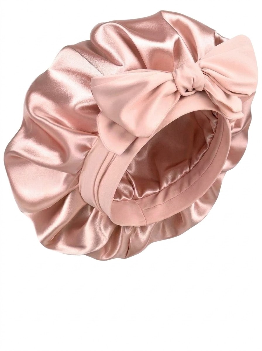 A YANIBEST Silk Hair Bonnet in pink against a white background, edited by Gemini