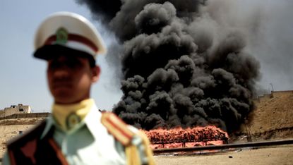 Iranian authorities burn confiscated drug shipments