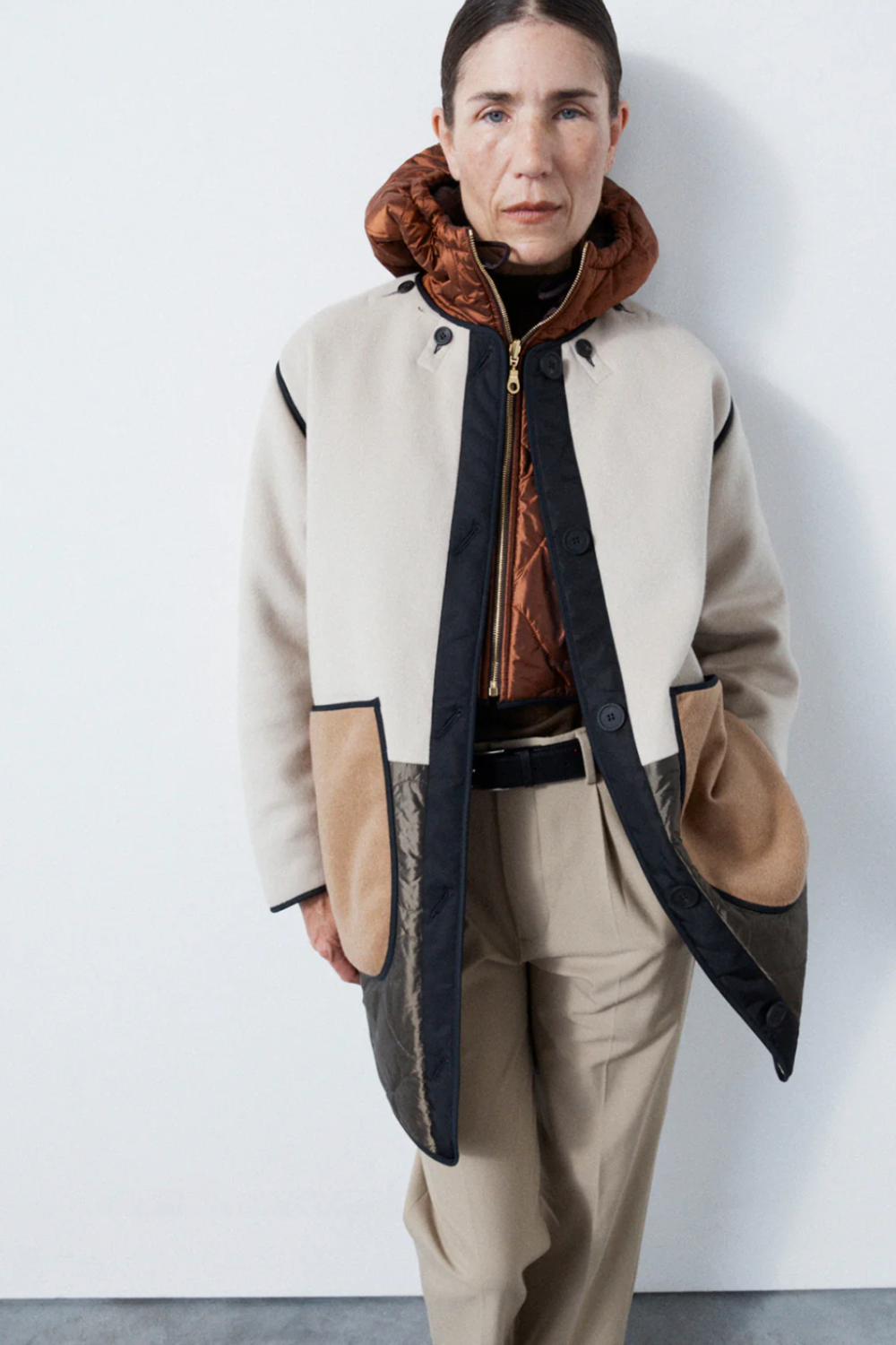 Marfa Stance coat and beige trousers