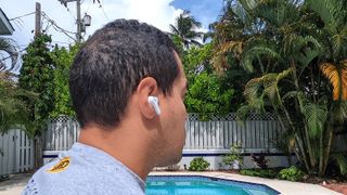 Testing the Donner DoBuds One's active noise cancellation in a backyard